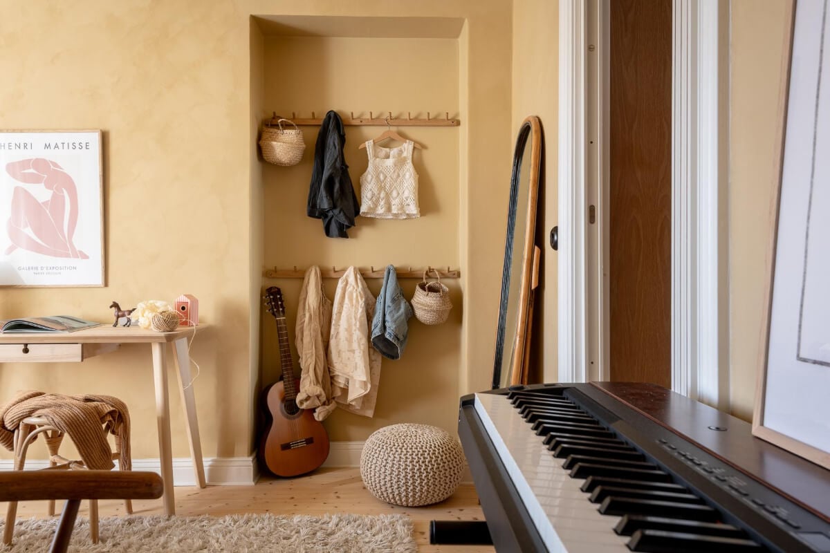 A Natural Color Palette, Period Features, & Grand Rooms in a Swedish Home 35 golden bedroom storage niche