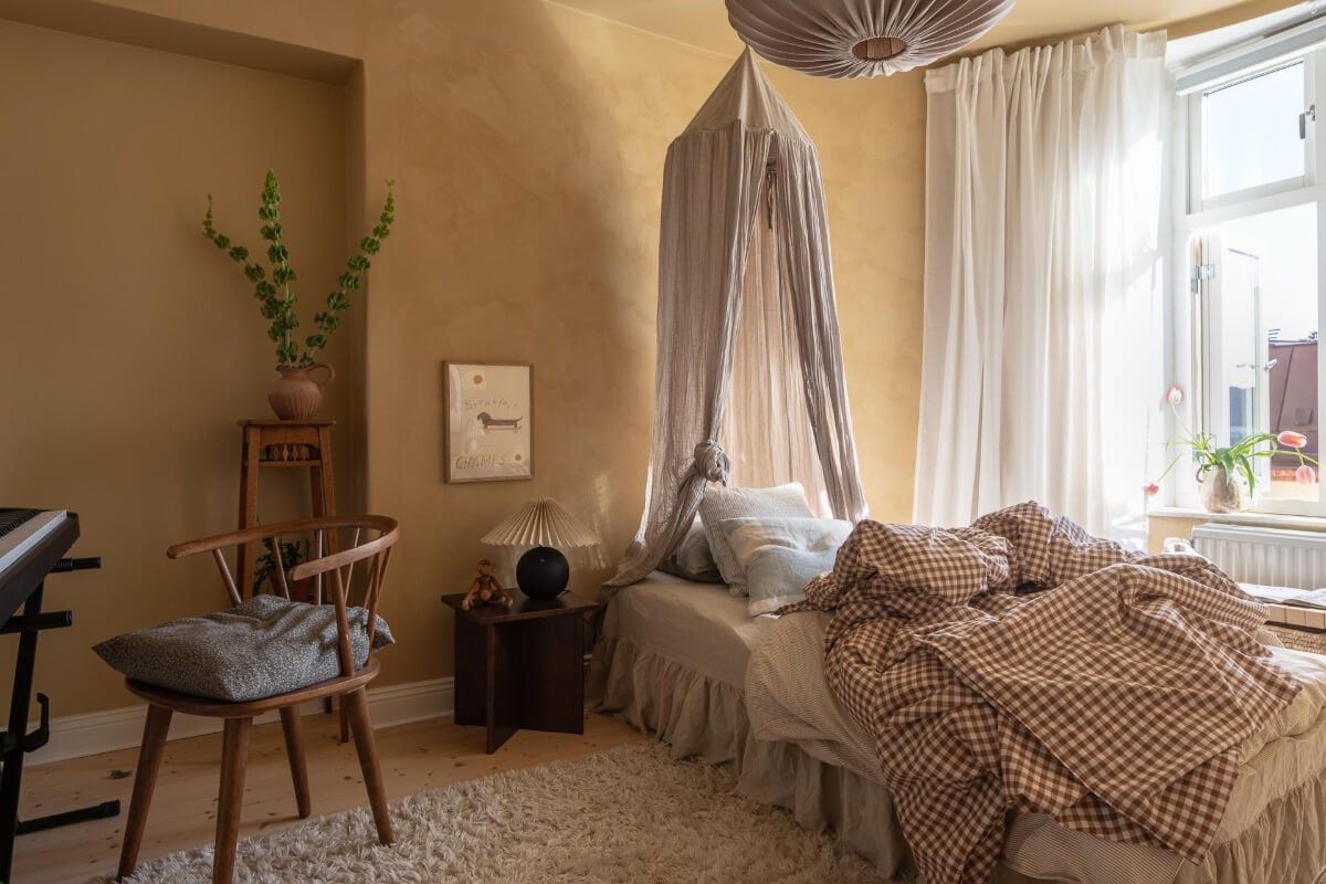 A Natural Color Palette, Period Features, & Grand Rooms in a Swedish Home 32 golden plaster walls bedroom