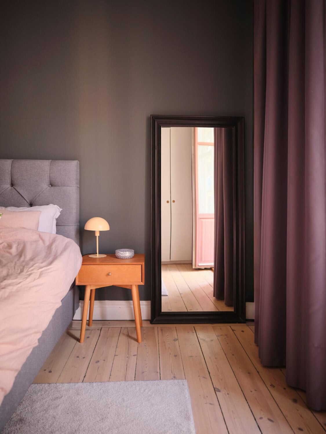 A Spacious Turn-of-the-Century Apartment with Nice Color Accents 18 gray bedroom wooden floor