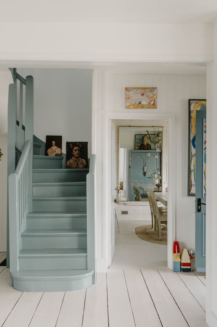 A Bright English Seaside Home Owned by Artists 17 gray-blue painted staircase