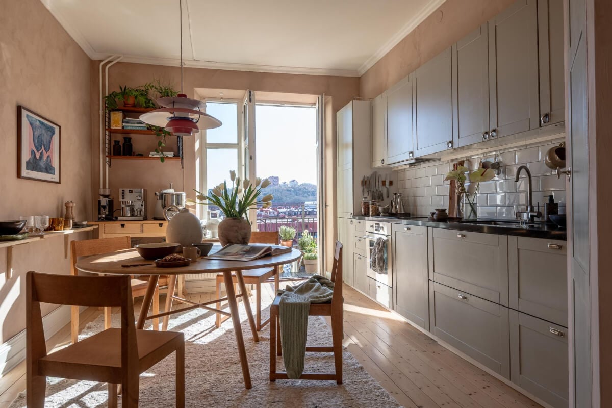 A Natural Color Palette, Period Features, & Grand Rooms in a Swedish Home 17 gray kitchen plaster walls balcony