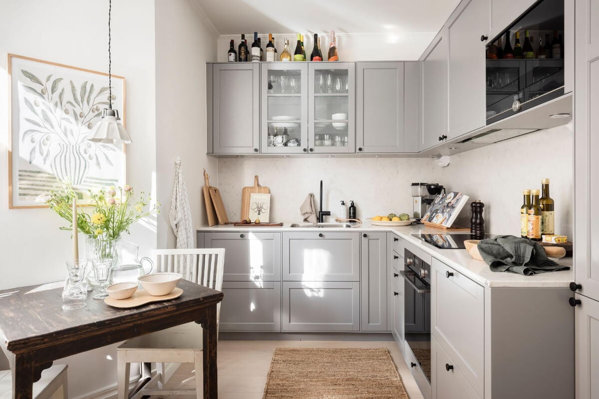 A Bright One-Bedroom Apartment with a Large Balcony 12 gray kitchen with wooden table