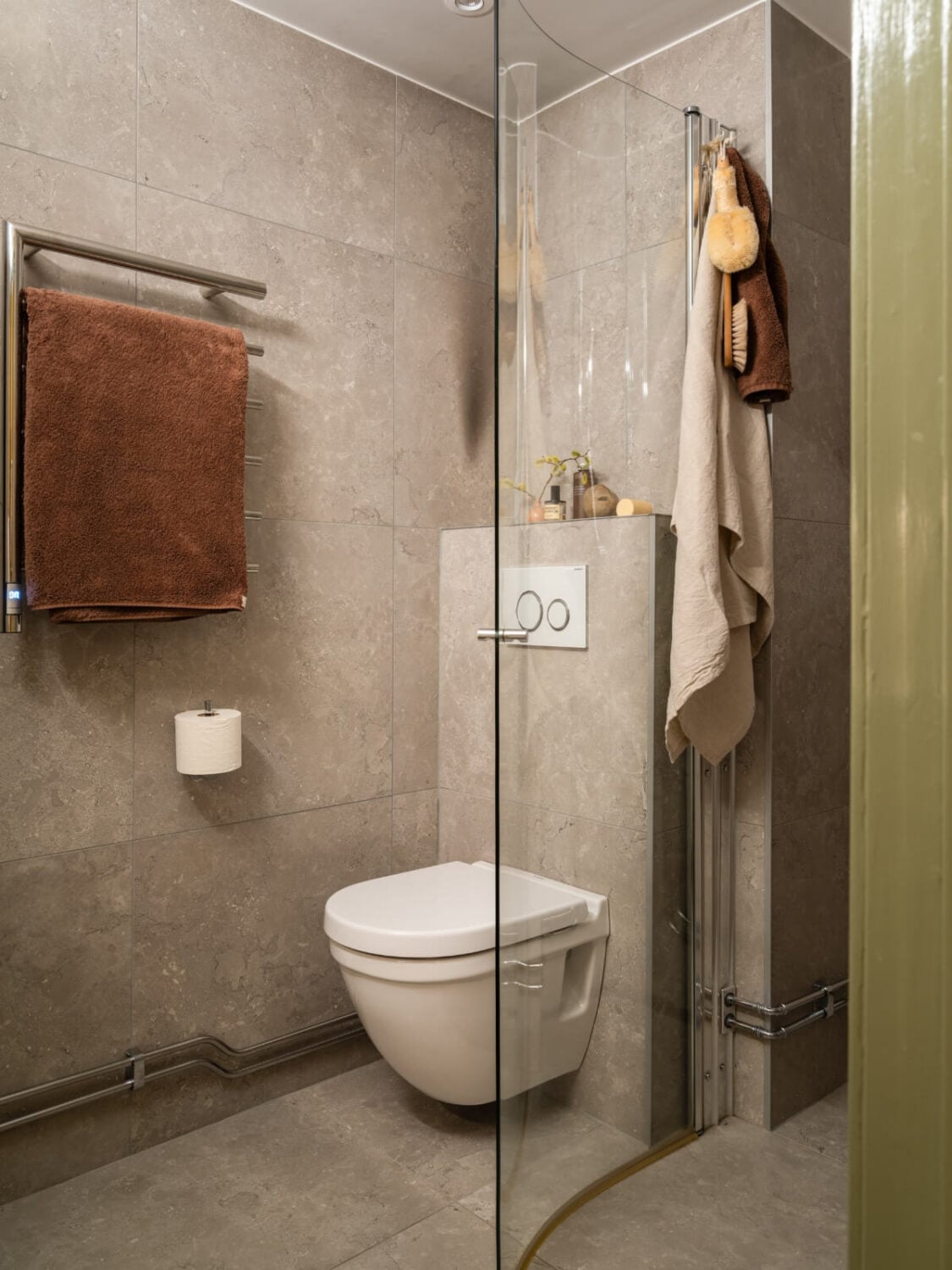 A Yellow and Green Color Palette in a Modern Swedish Apartment 19 gray-tiled bathroom