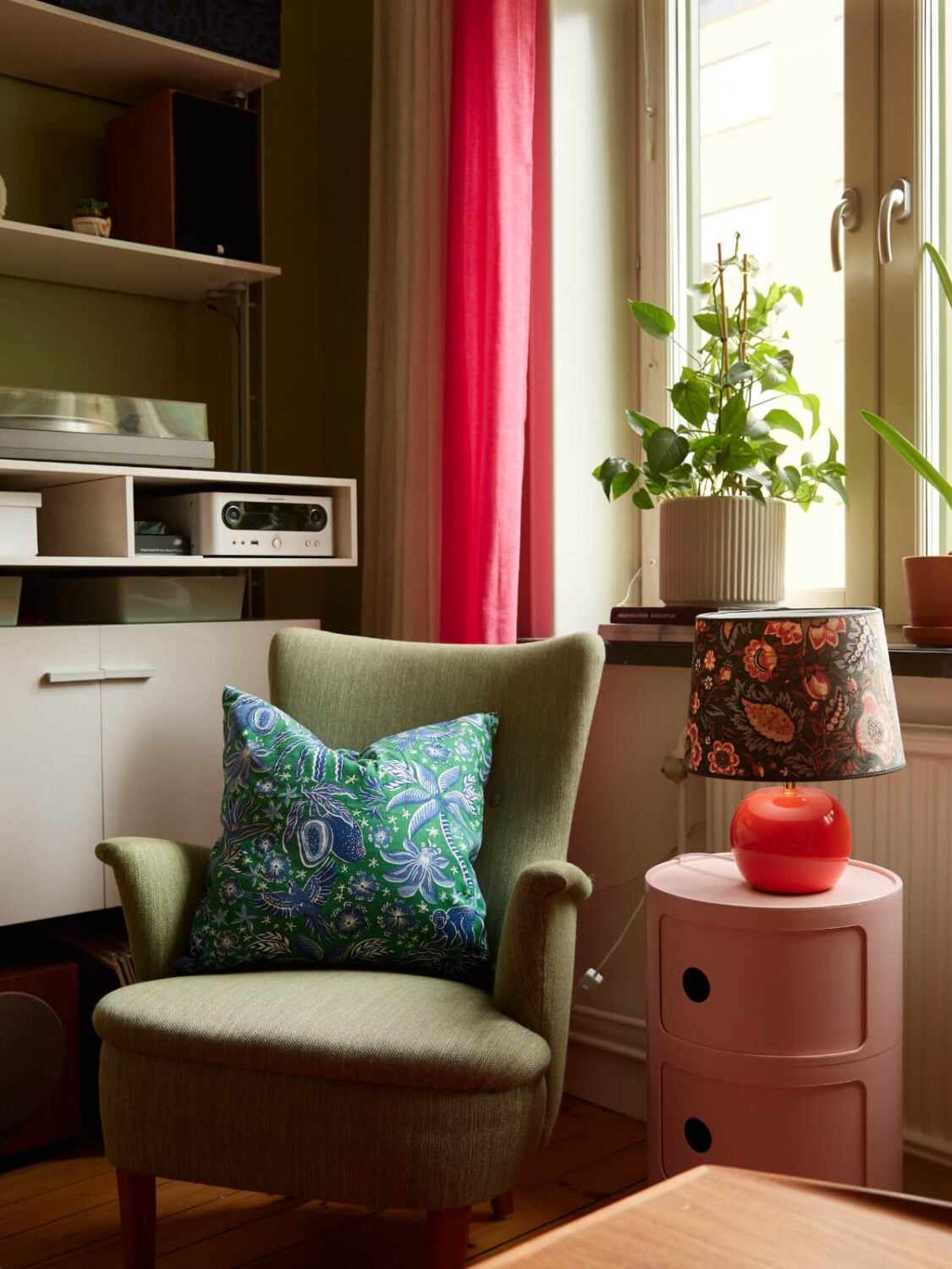 A Colorful Studio Apartment with Smart Storage and A Cozy Bed Niche 5 green armchair