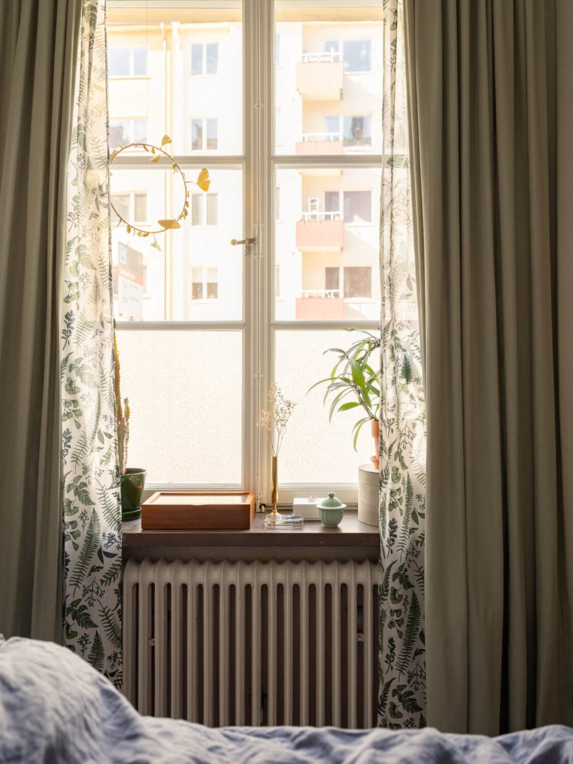 A Small, Cozy Apartment with Built-in Storage and Bookshelves 17 green bedroom curtains
