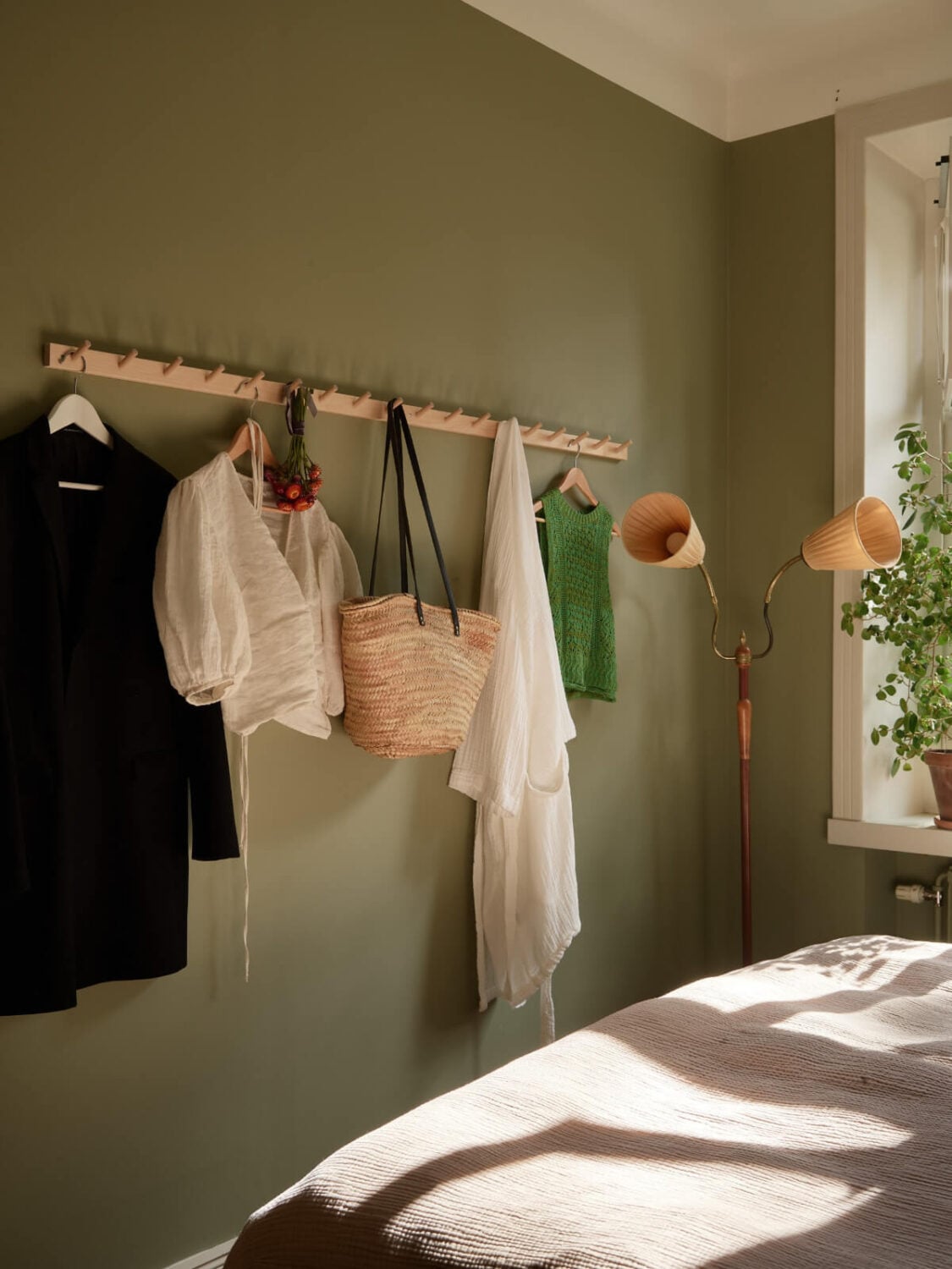 A Nature-Inspired Color Palette in a Stockholm Apartment 18 green bedroom wall hooks