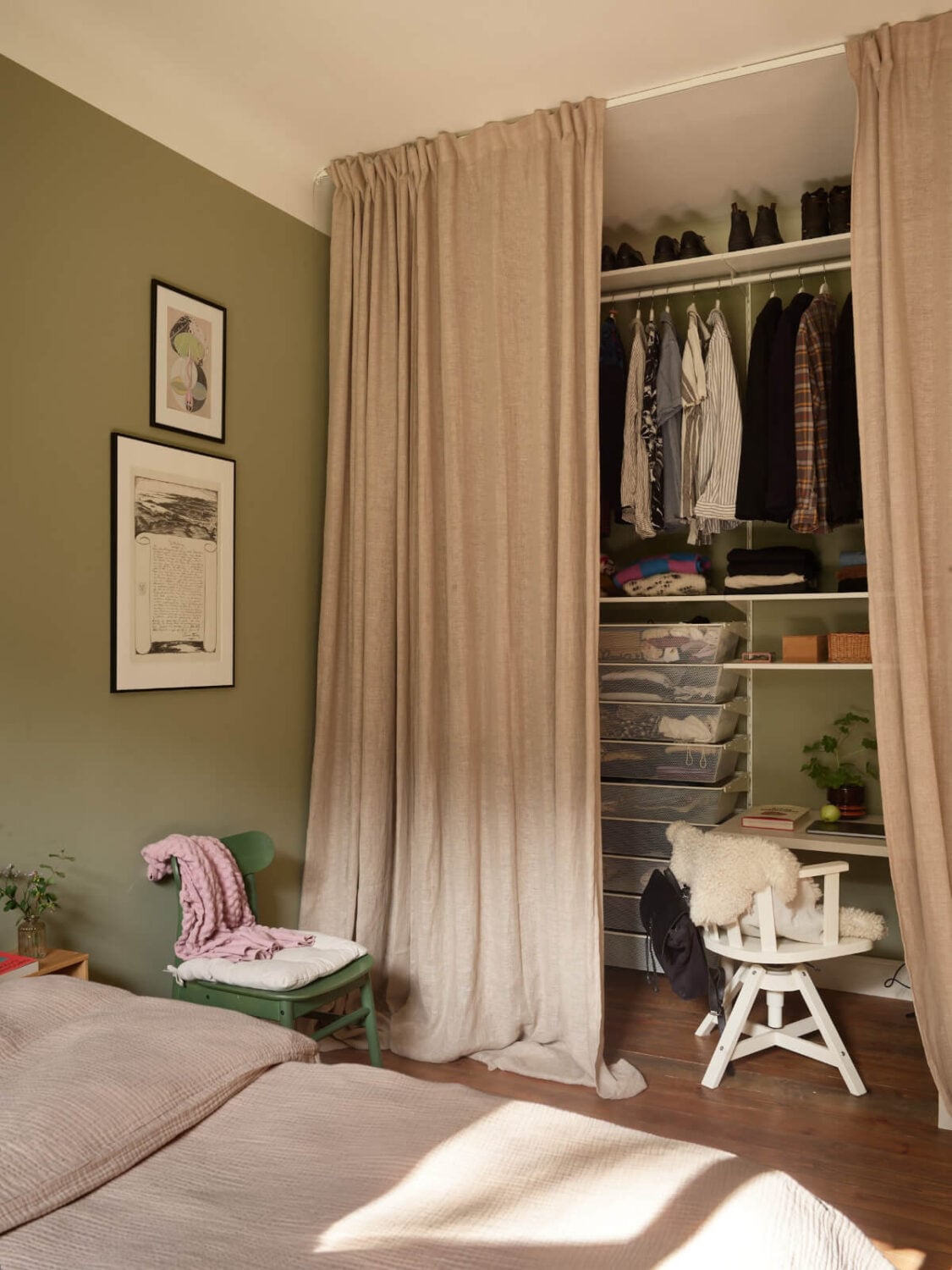 A Nature-Inspired Color Palette in a Stockholm Apartment 16 green bedroom wardrobes and home office behind curtain