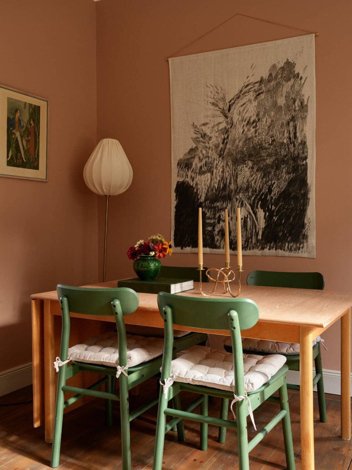 A Nature-Inspired Color Palette in a Stockholm Apartment 6 green dining table chairs