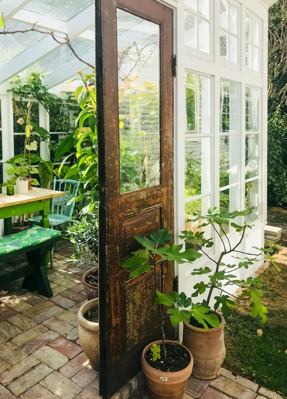 Best of 2025: Balconies and Gardens 57 green house rustic wooden door