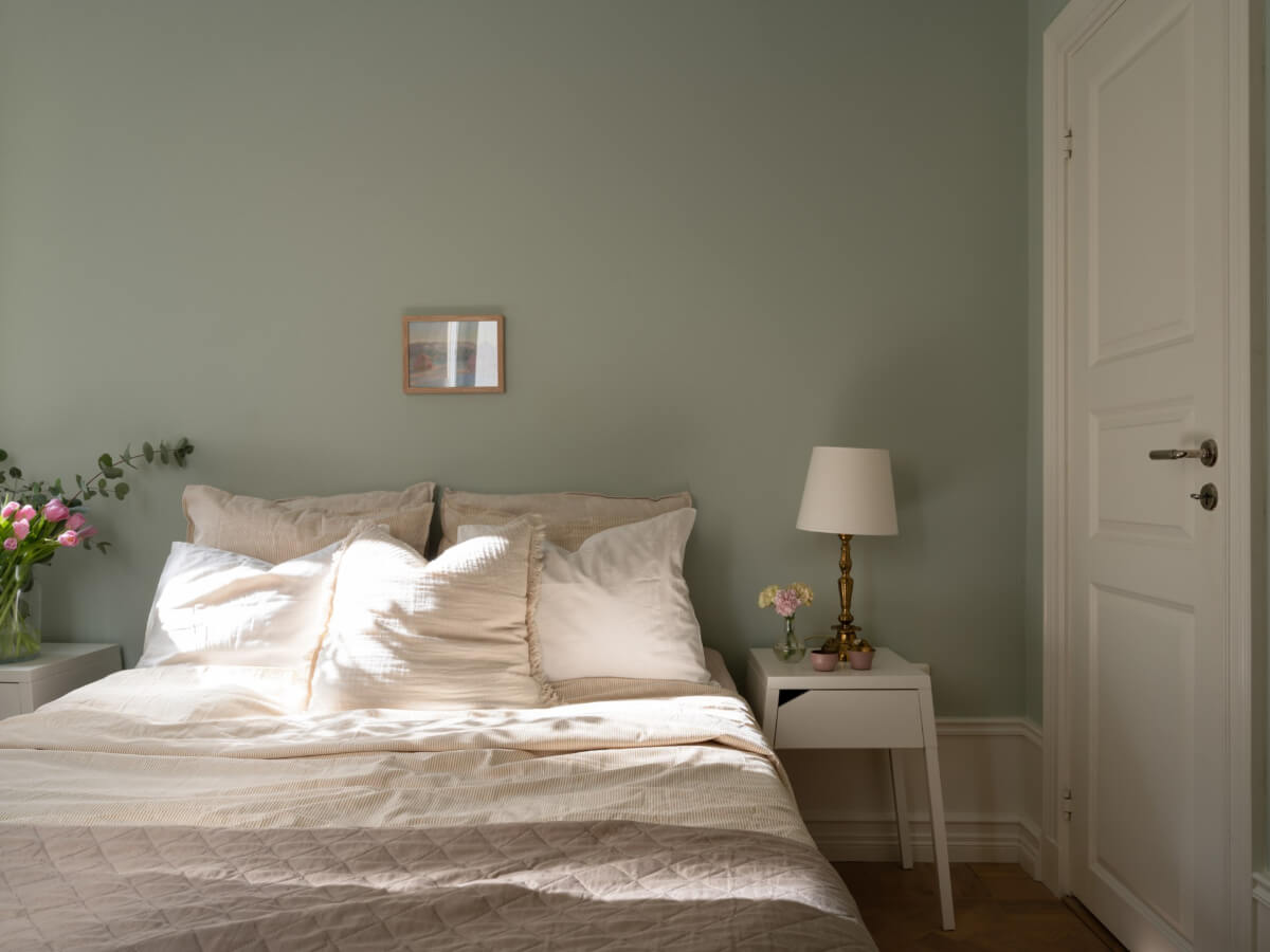A Small Apartment with Green Color Accents and a Cozy Patio Terrace 13 green walls bedroom