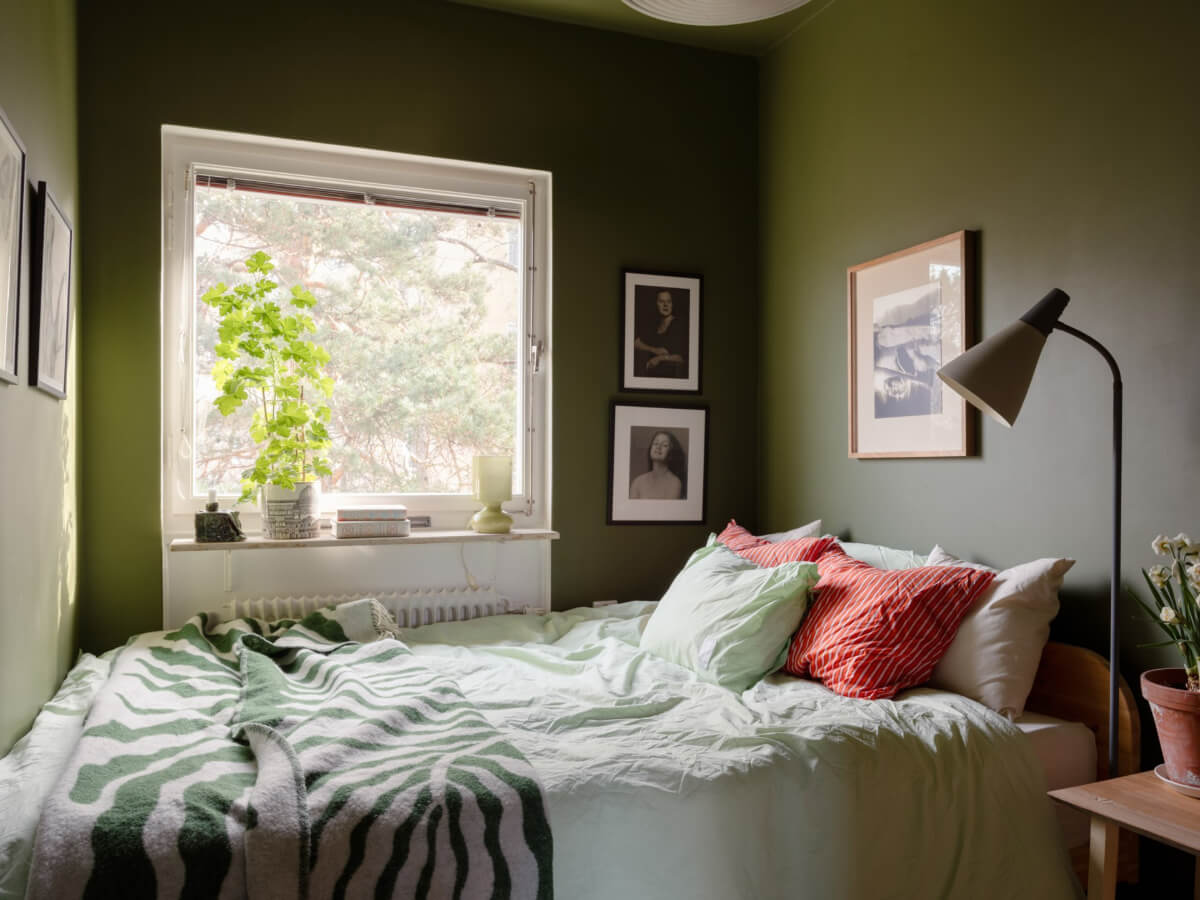 Color Accents in a Renovated Midcentury Apartment in Stockholm 18 green walls small bedroom