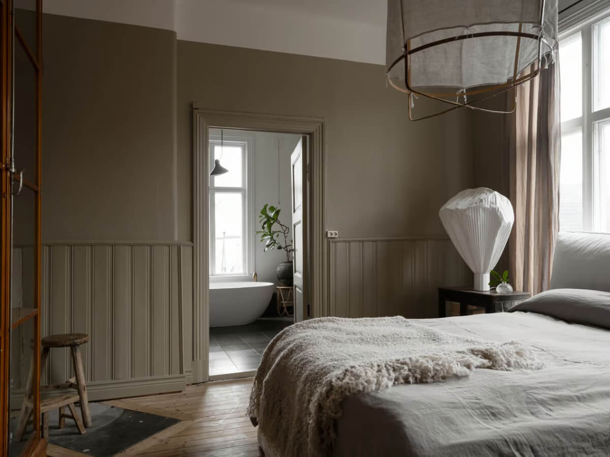 Artilleriet Co-Founder is Selling Her Art Nouveau Villa in Sweden 16 greige bedroom wall paneling en-suite bathroom