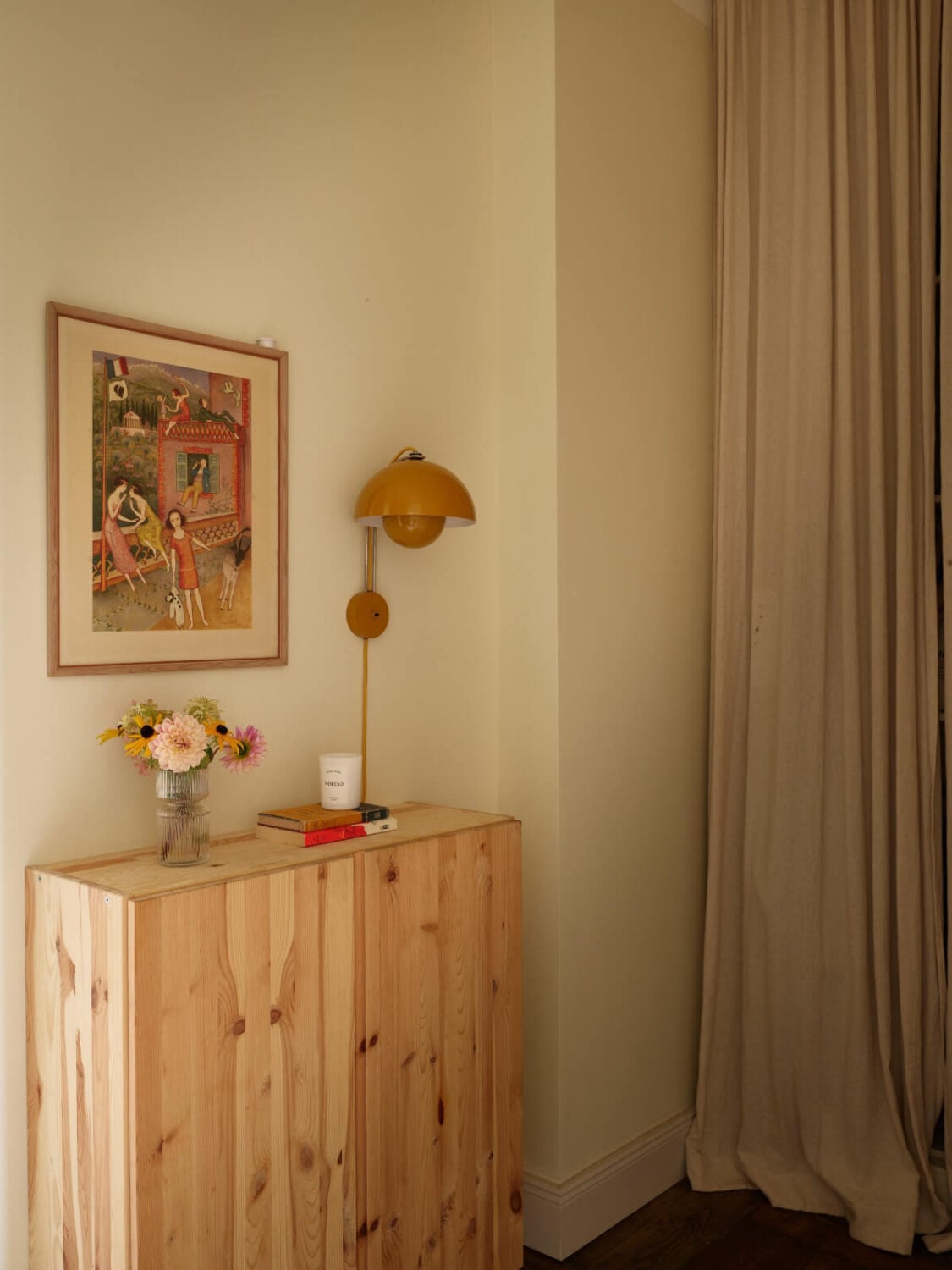 A Nature-Inspired Color Palette in a Stockholm Apartment 27 hall cabinet yellow wall light