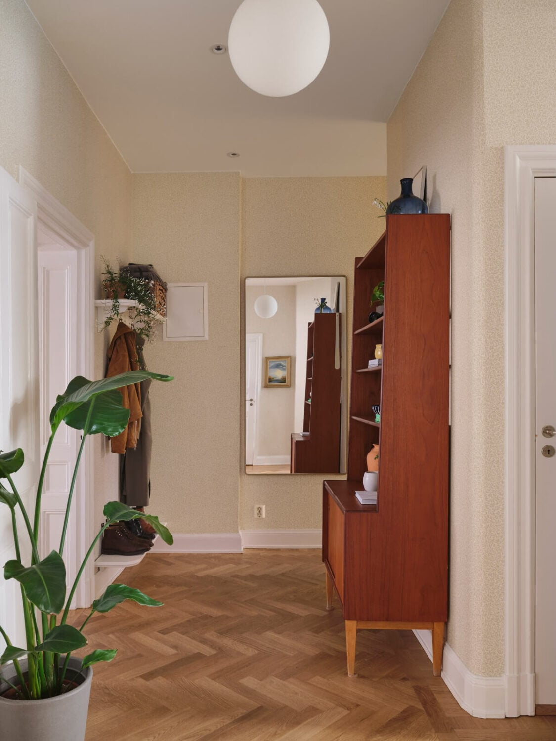 Classic Elements and Light Rooms in a Lovely Family Apartment 34 hall midcentury cabinet Classic Elements and Light Rooms in a Lovely Family Apartment
