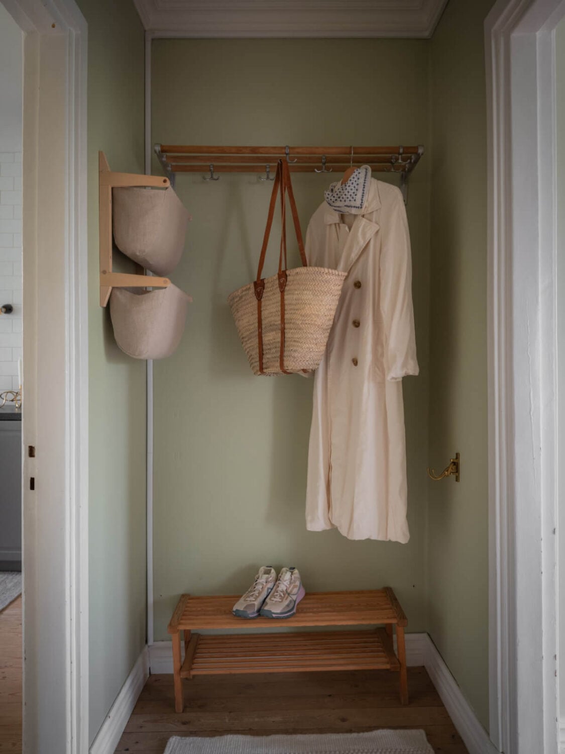 A Soft Color Palette and a Charming Kitchen in a Swedish Apartment 35 hall niche for coats A Soft Color Palette and a Charming Kitchen in a Swedish Apartment