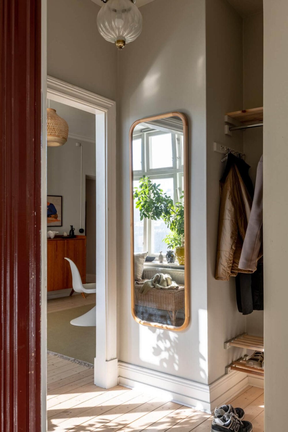 A Natural Color Palette, Period Features, & Grand Rooms in a Swedish Home 45 hall rattan mirror niche for coats and shoes