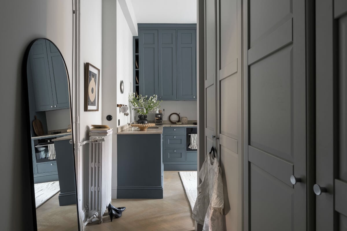 A Stylish Swedish Studio Apartment with a Blue Kitchen 19 hall view into kitchen