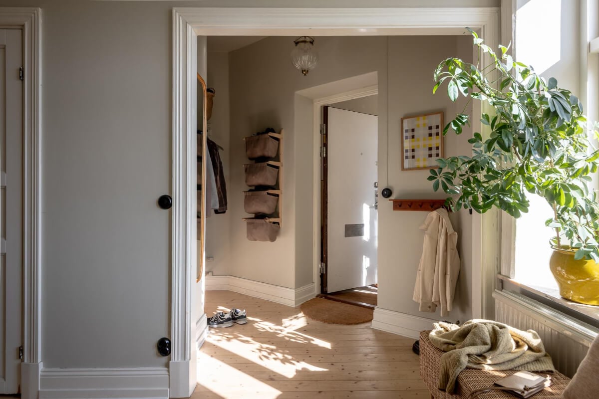A Natural Color Palette, Period Features, & Grand Rooms in a Swedish Home 46 hall wall-mounted storage baskets