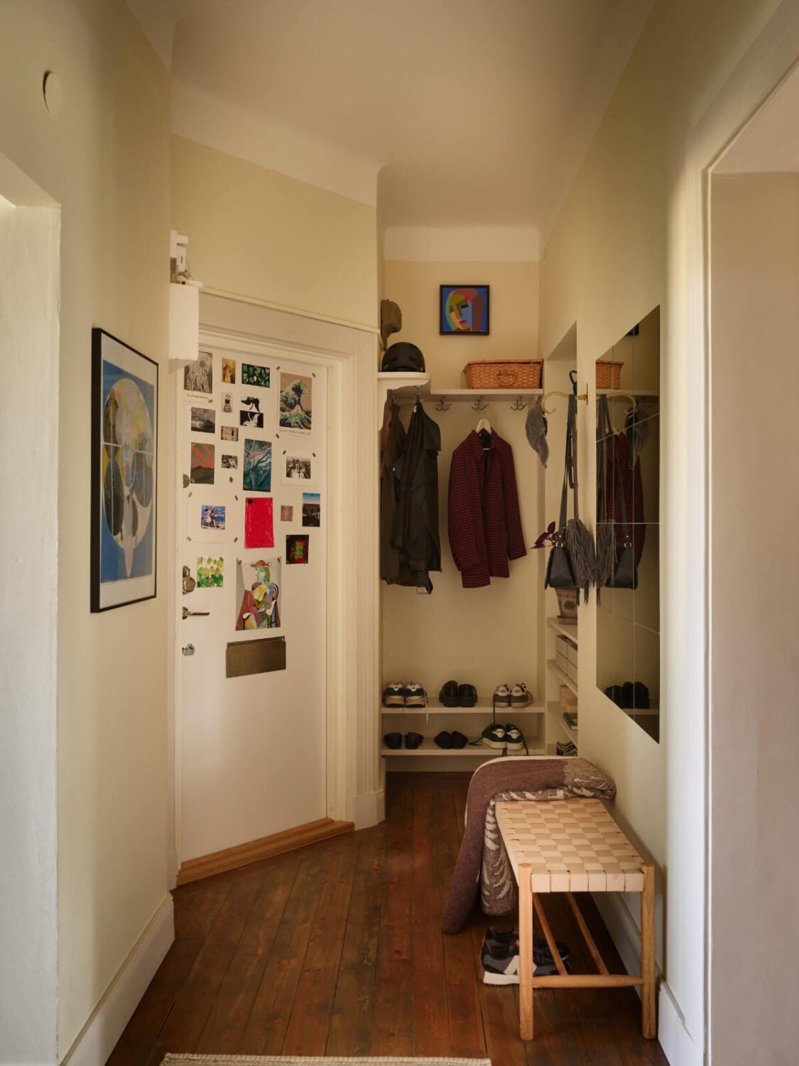 A Nature-Inspired Color Palette in a Stockholm Apartment 28 hall with niche for coat and shoe storage