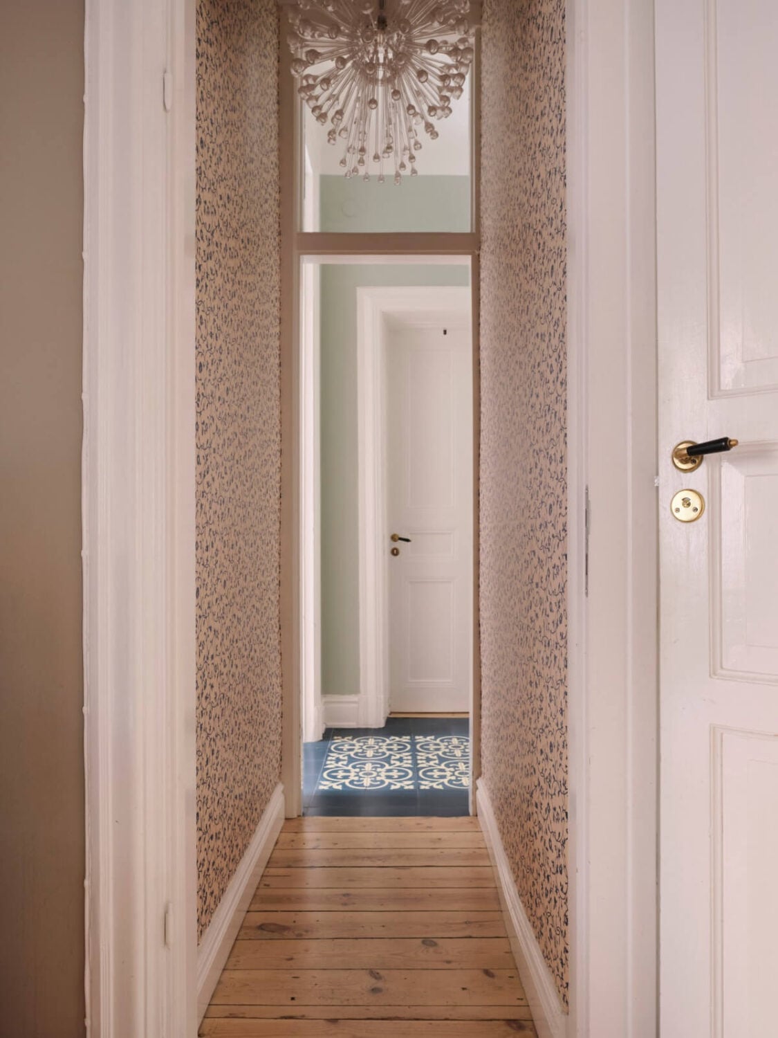 A Spacious Turn-of-the-Century Apartment with Nice Color Accents 21 hall with wallpaper
