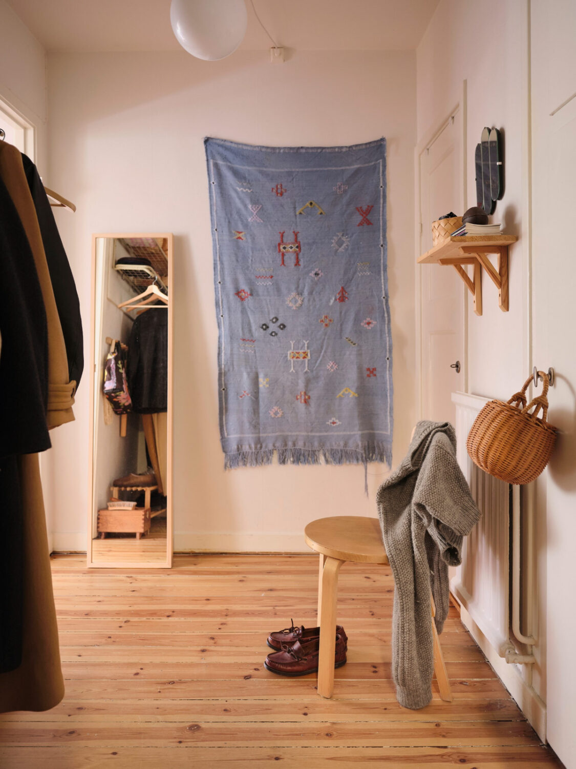 A Light-Filled Functionalist Apartment in Stockholm 18 hall wooden shelf