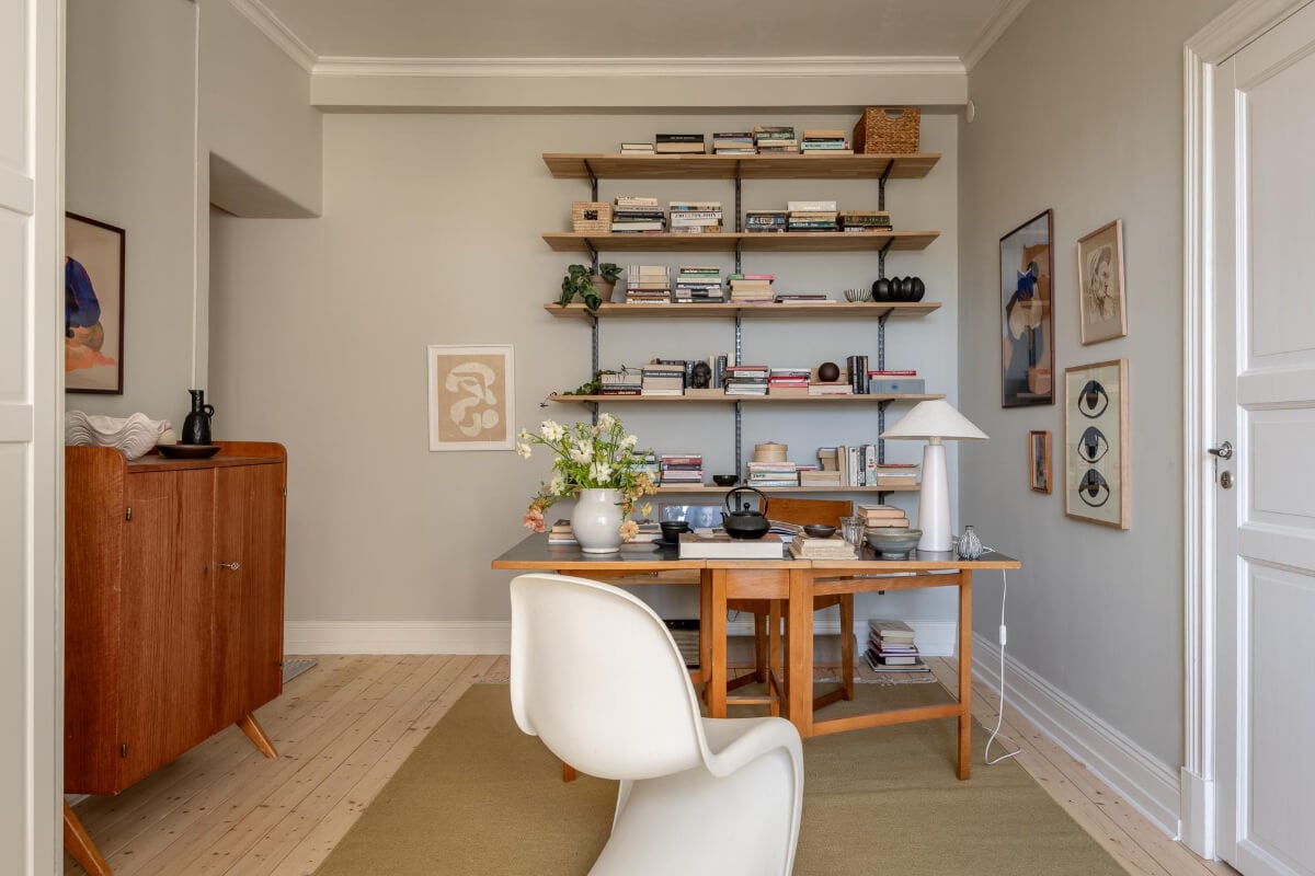 A Natural Color Palette, Period Features, & Grand Rooms in a Swedish Home 38 home office gray walls bookshelves
