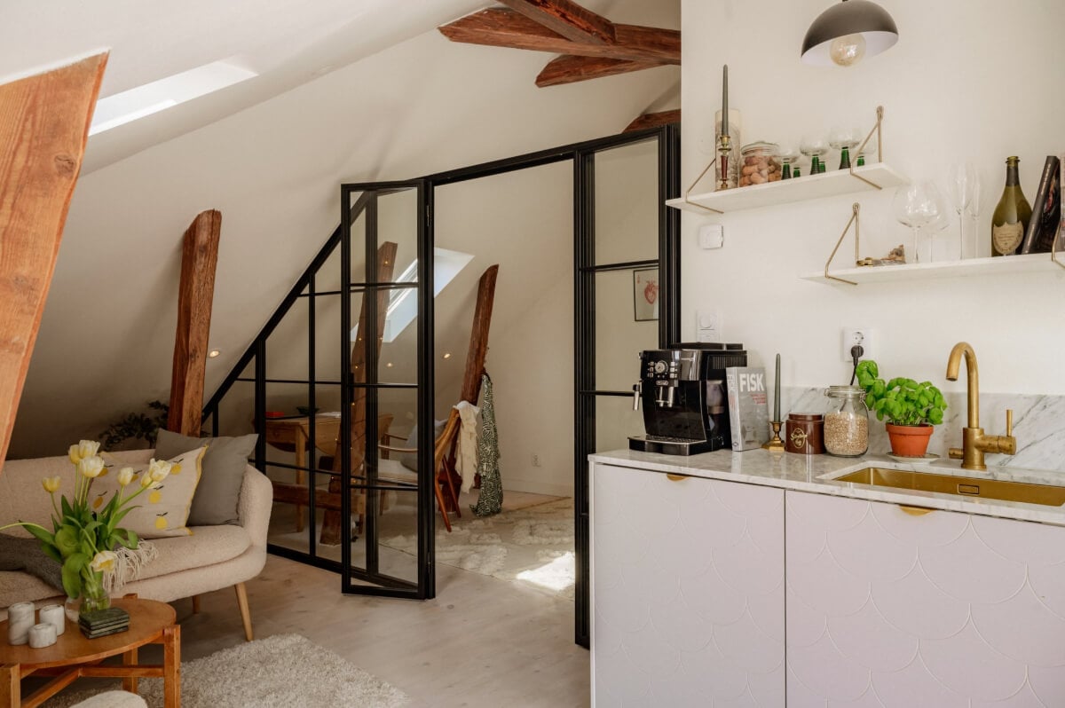 A Bright Attic Apartment with Exposed Beams and a Roof Terrace 12 industrial glass wall