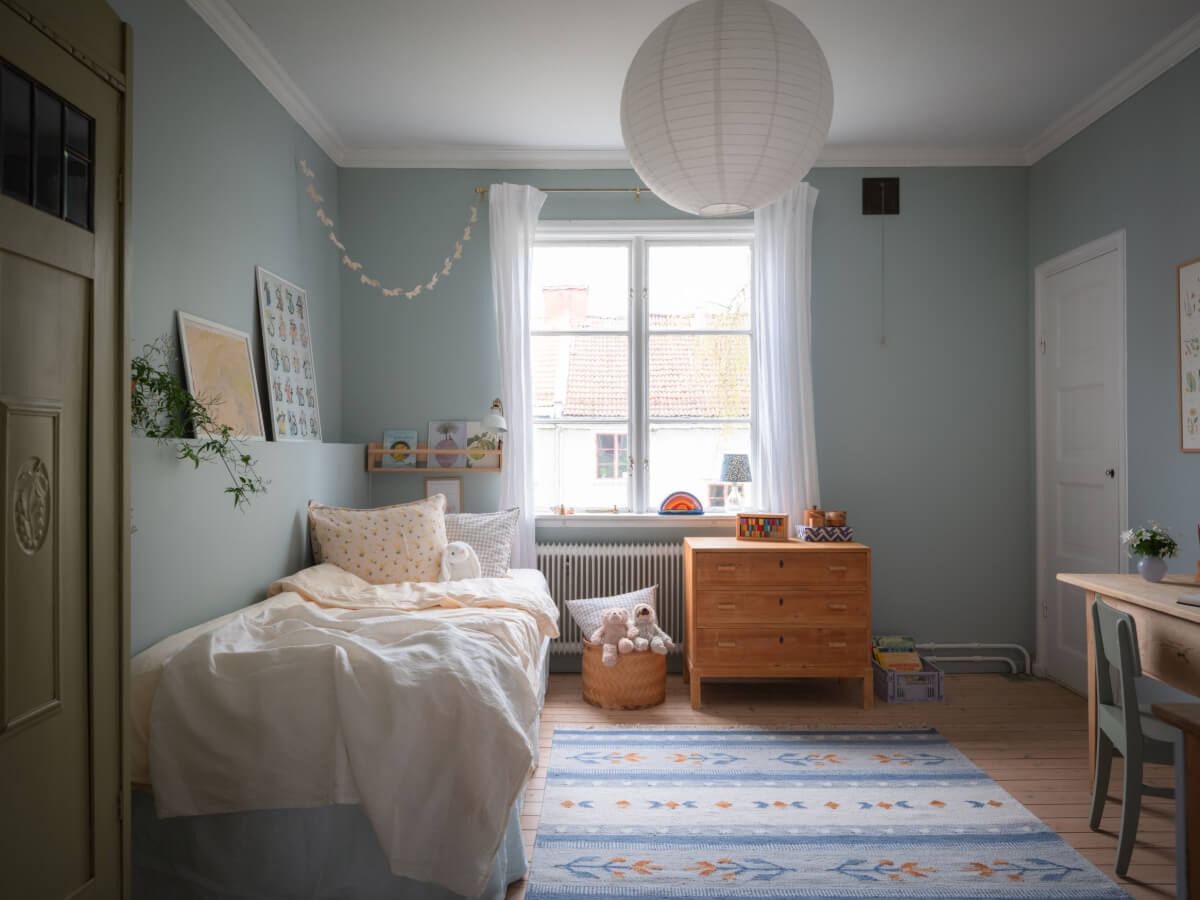 A Soft Color Palette and a Charming Kitchen in a Swedish Apartment 27 kids bedroom blue-gray walls