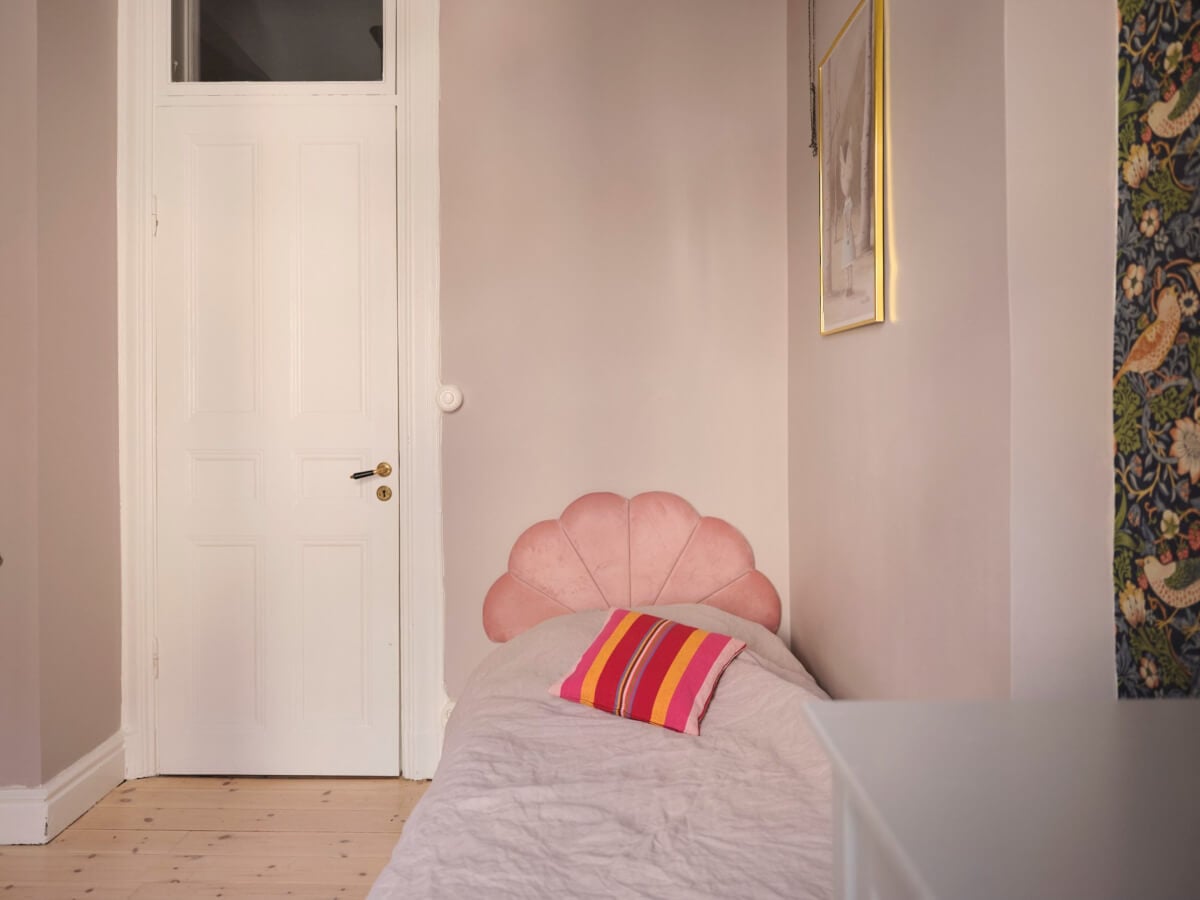 A Spacious Turn-of-the-Century Apartment with Nice Color Accents 23 kids bedroom pink headboard