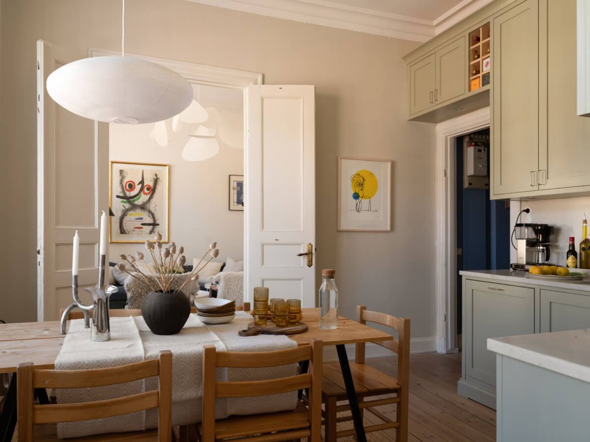 Turn-of-the-Century Charm and Site-Built Storage in a Stockholm Apartment 14 kitchen cabinet over doorway