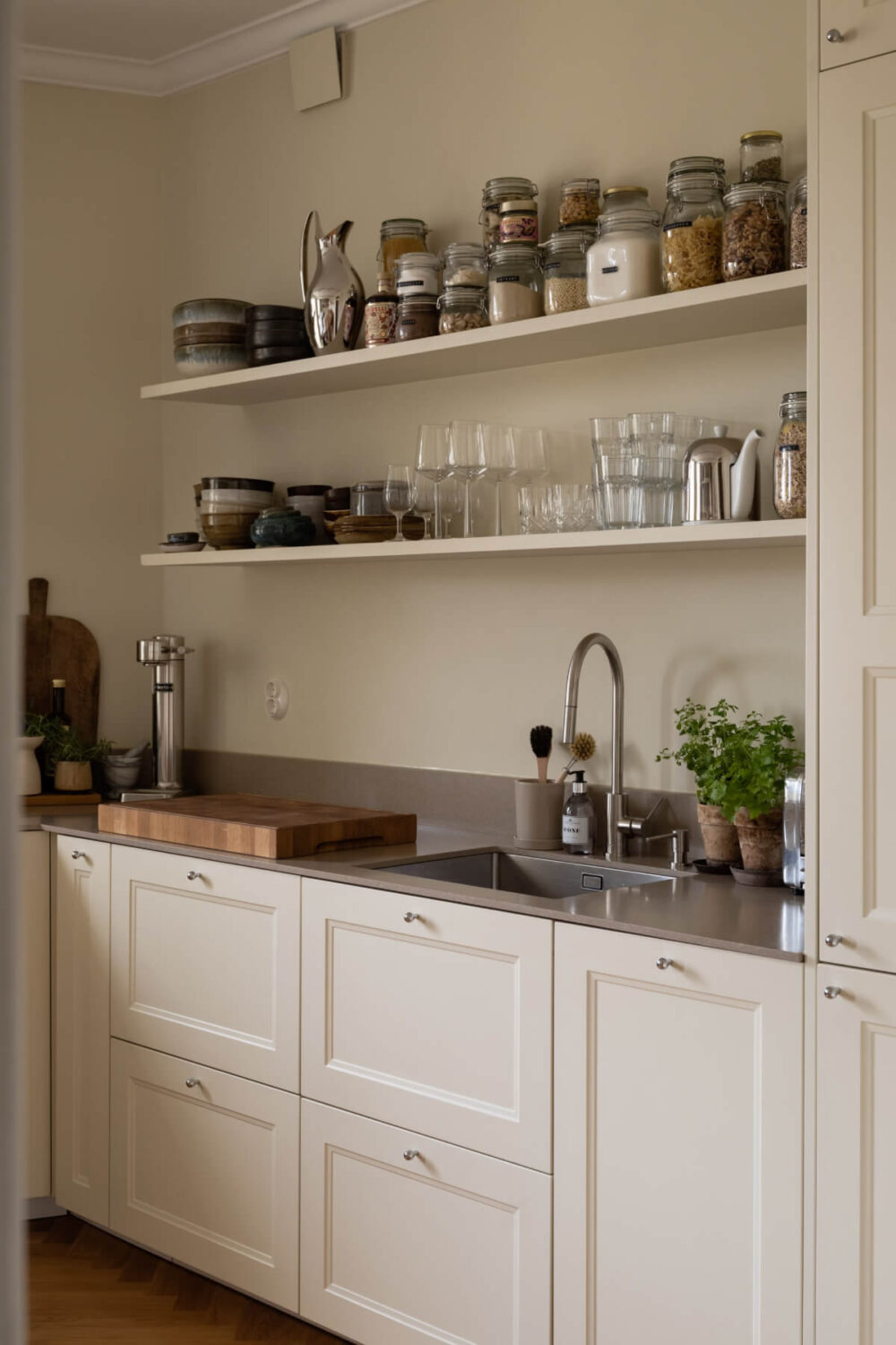 A Beige Color Palette and Built-in Bookshelves in a 1920s Apartment 10 kitchen detail
