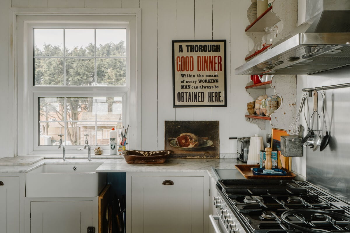 A Bright English Seaside Home Owned by Artists 9 kitchen detail butler sink under window