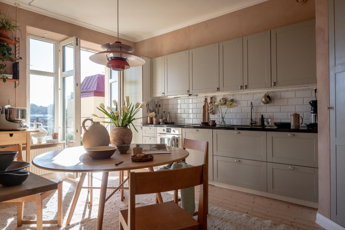 A Natural Color Palette, Period Features, & Grand Rooms in a Swedish Home 18 kitchen gray cabinets round dining table