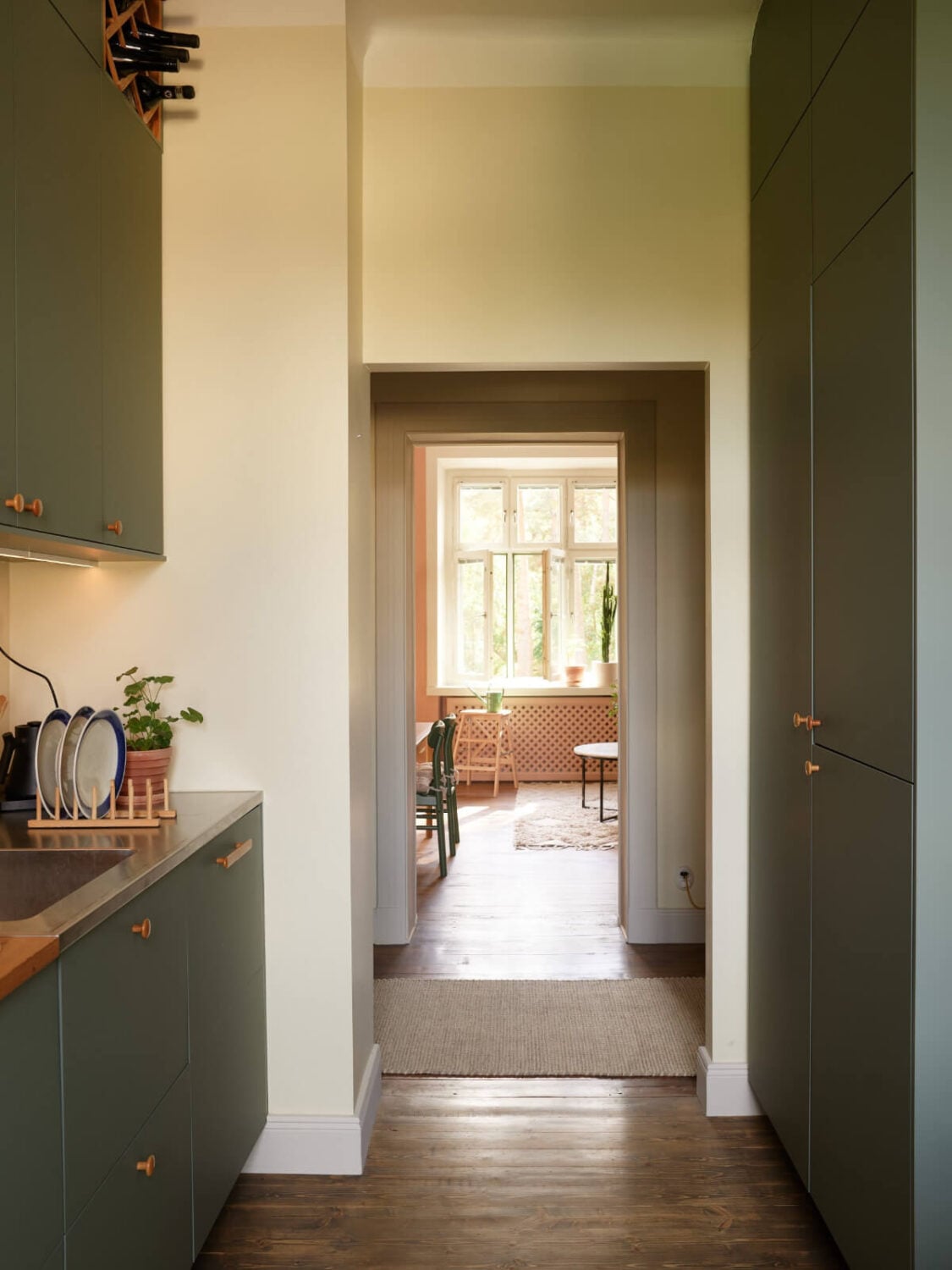 A Nature-Inspired Color Palette in a Stockholm Apartment 13 kitchen green cabinets