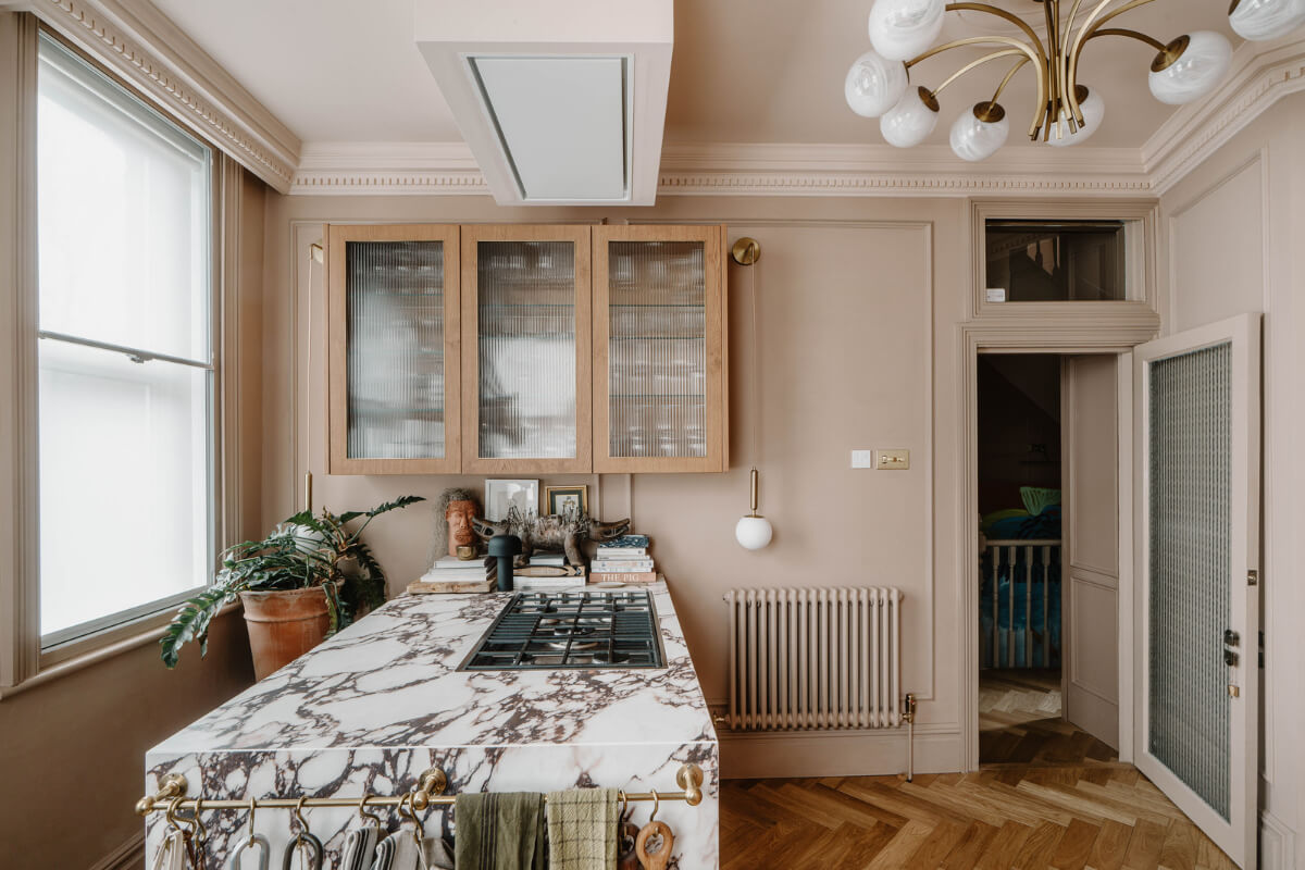 A Classy Apartment on the Top Floors of a 19th-Century Building 6 kitchen marble island