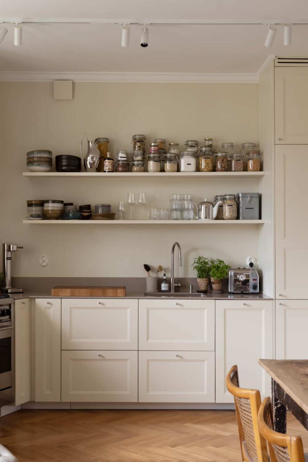 A Beige Color Palette and Built-in Bookshelves in a 1920s Apartment 9 kitchen shelves