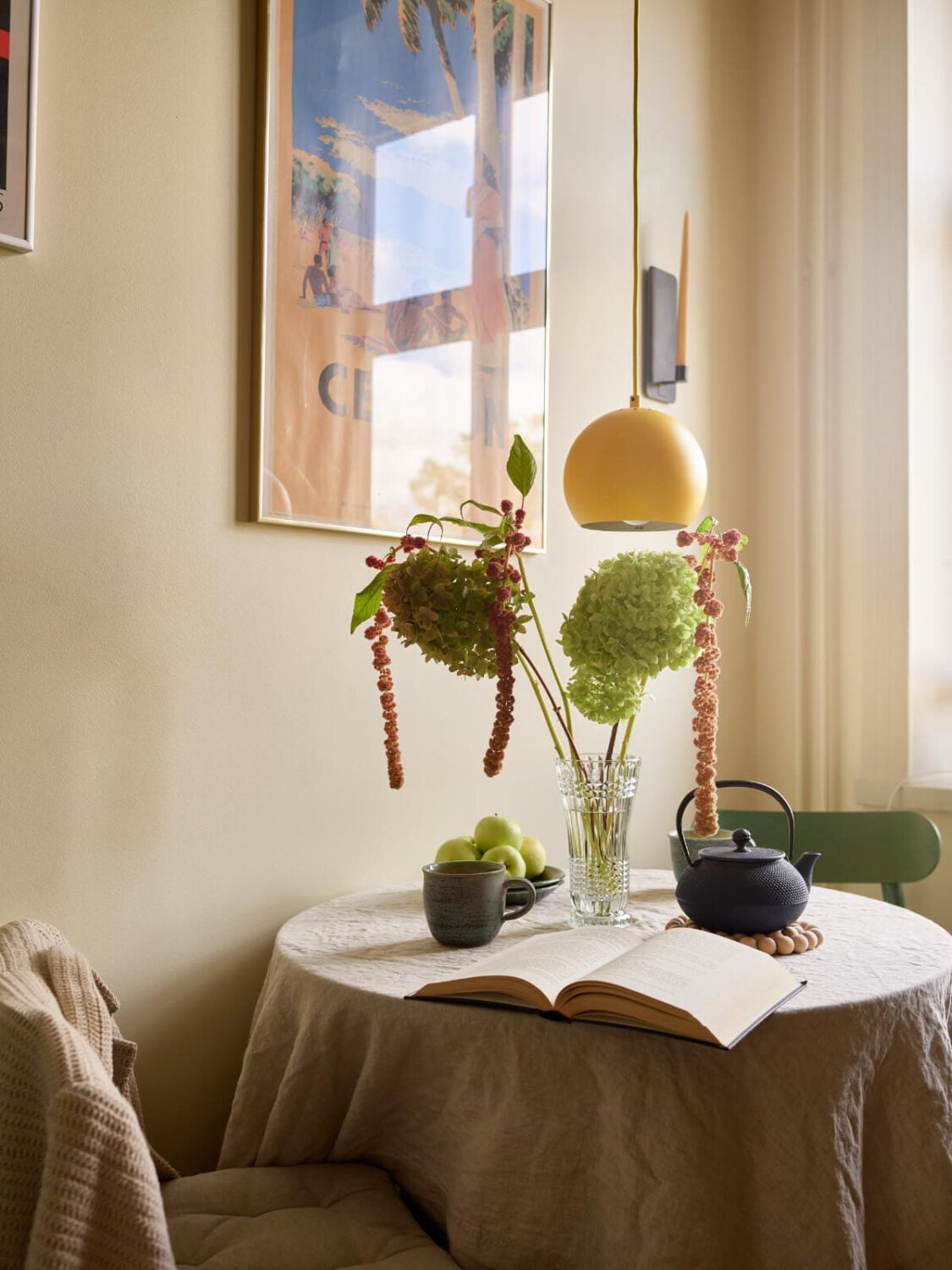 A Nature-Inspired Color Palette in a Stockholm Apartment 10 kitchen table yellow pendant light