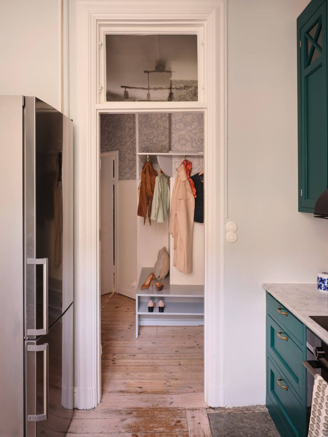 A Spacious Turn-of-the-Century Apartment with Nice Color Accents 15 kitchen view into hall
