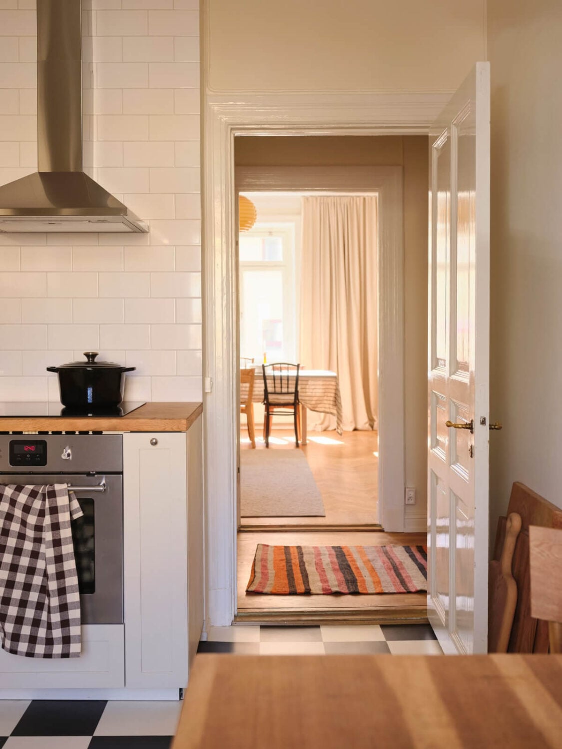 Warm, Natural Light in a Renovated Turn-of-the-Century Apartment 20 kitchen view into living room
