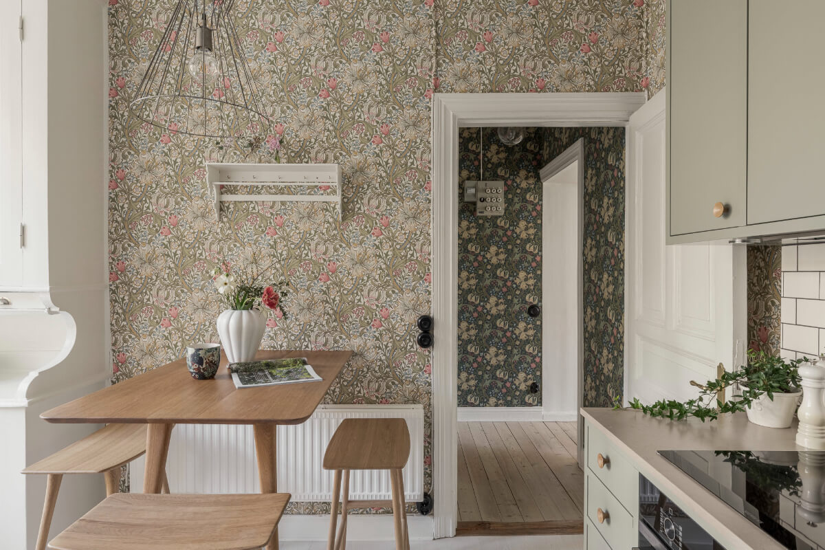 A Bright Swedish Apartment with Period Features and a Green Kitchen 9 kitchen wallpaper bar table stools
