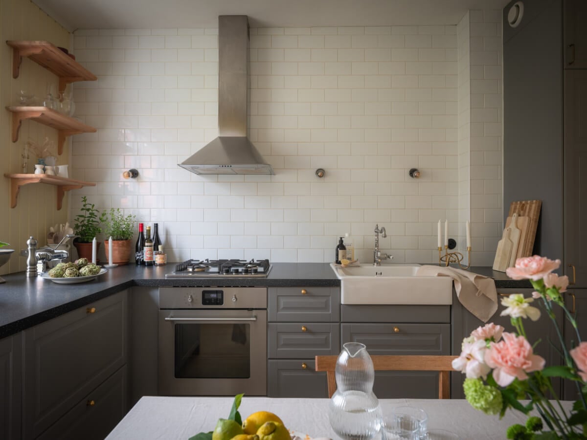 A Soft Color Palette and a Charming Kitchen in a Swedish Apartment 3 kitchen white backsplash tiles to ceiling