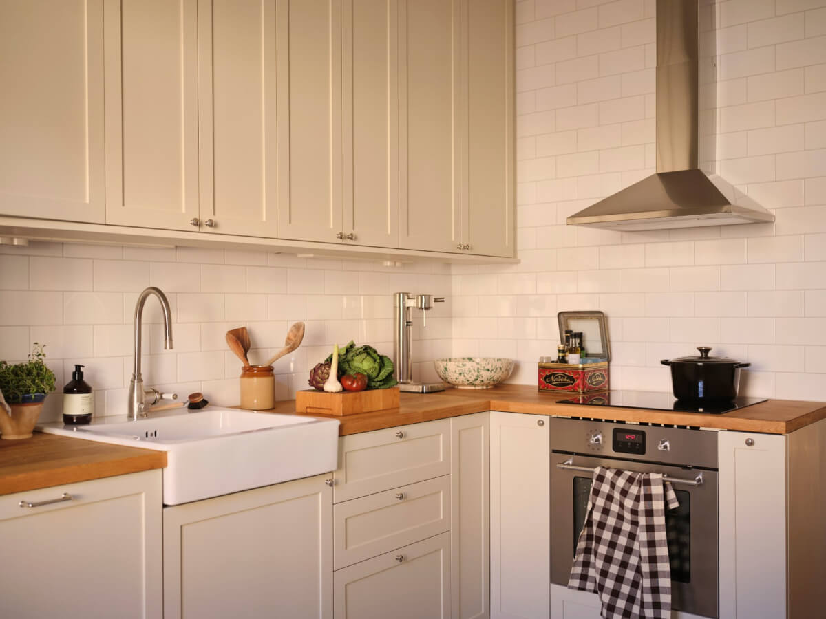 Warm, Natural Light in a Renovated Turn-of-the-Century Apartment 18 kitchen white tiles