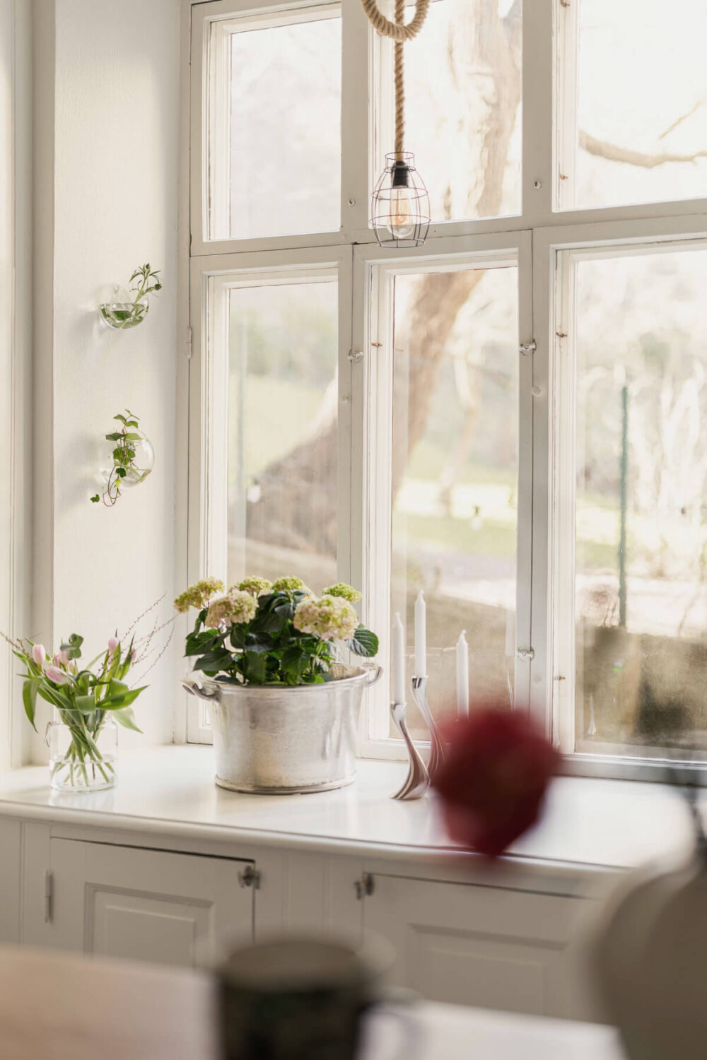 A Bright Swedish Apartment with Period Features and a Green Kitchen 7 kitchen window