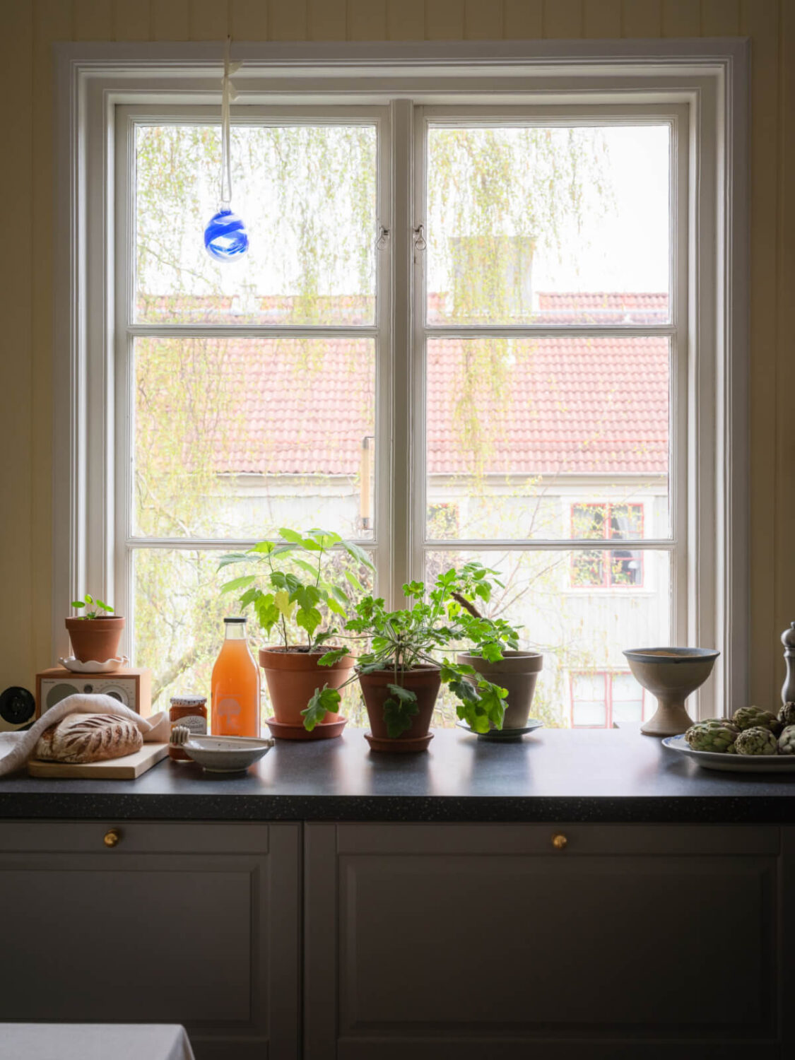 A Soft Color Palette and a Charming Kitchen in a Swedish Apartment 6 kitchen window