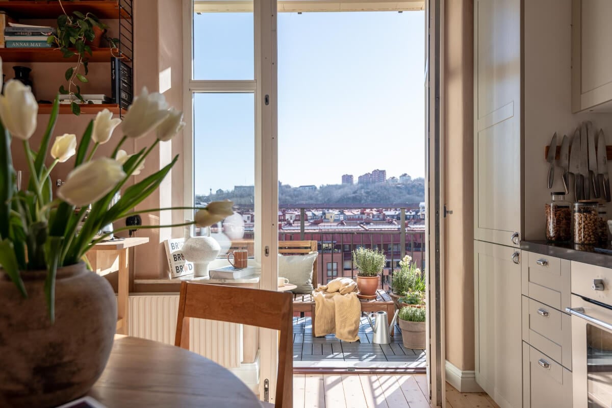 A Natural Color Palette, Period Features, & Grand Rooms in a Swedish Home 20 kitchen with balcony