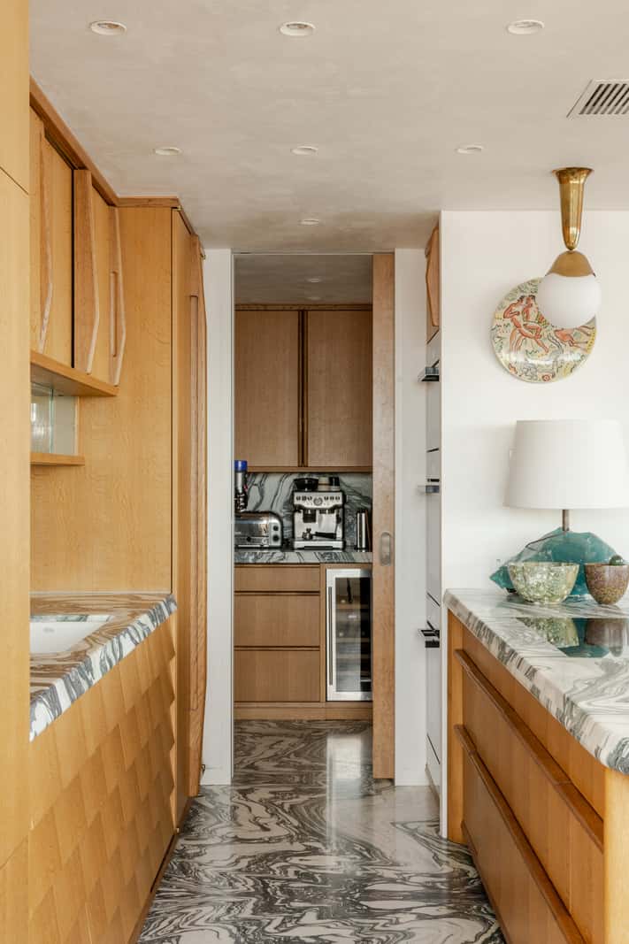 Oak and Marble in a Spectacular Brutalist Apartment in London 10 kitchen with pantry