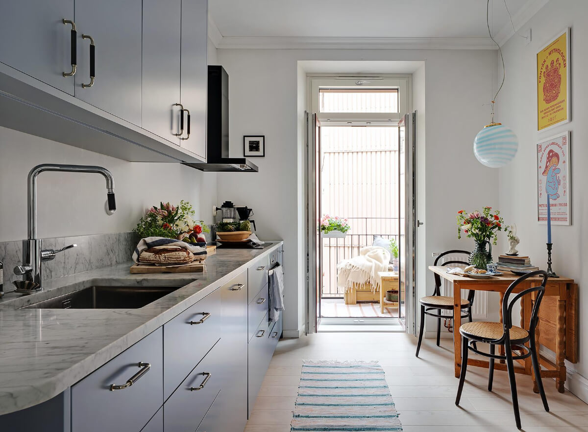 Pink and Blue Tones in a Late 19th-Century Apartment 17 kitchen with vintage wooden folding table