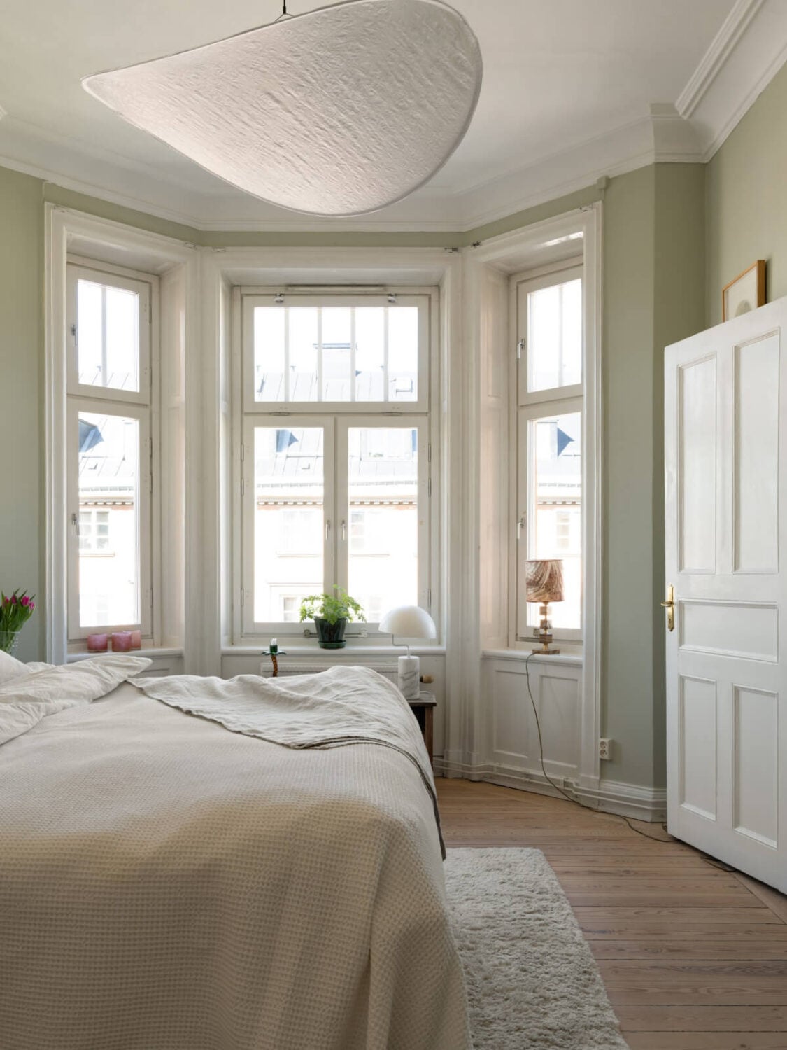 Turn-of-the-Century Charm and Site-Built Storage in a Stockholm Apartment 17 large-bay-windows-master-bedroom