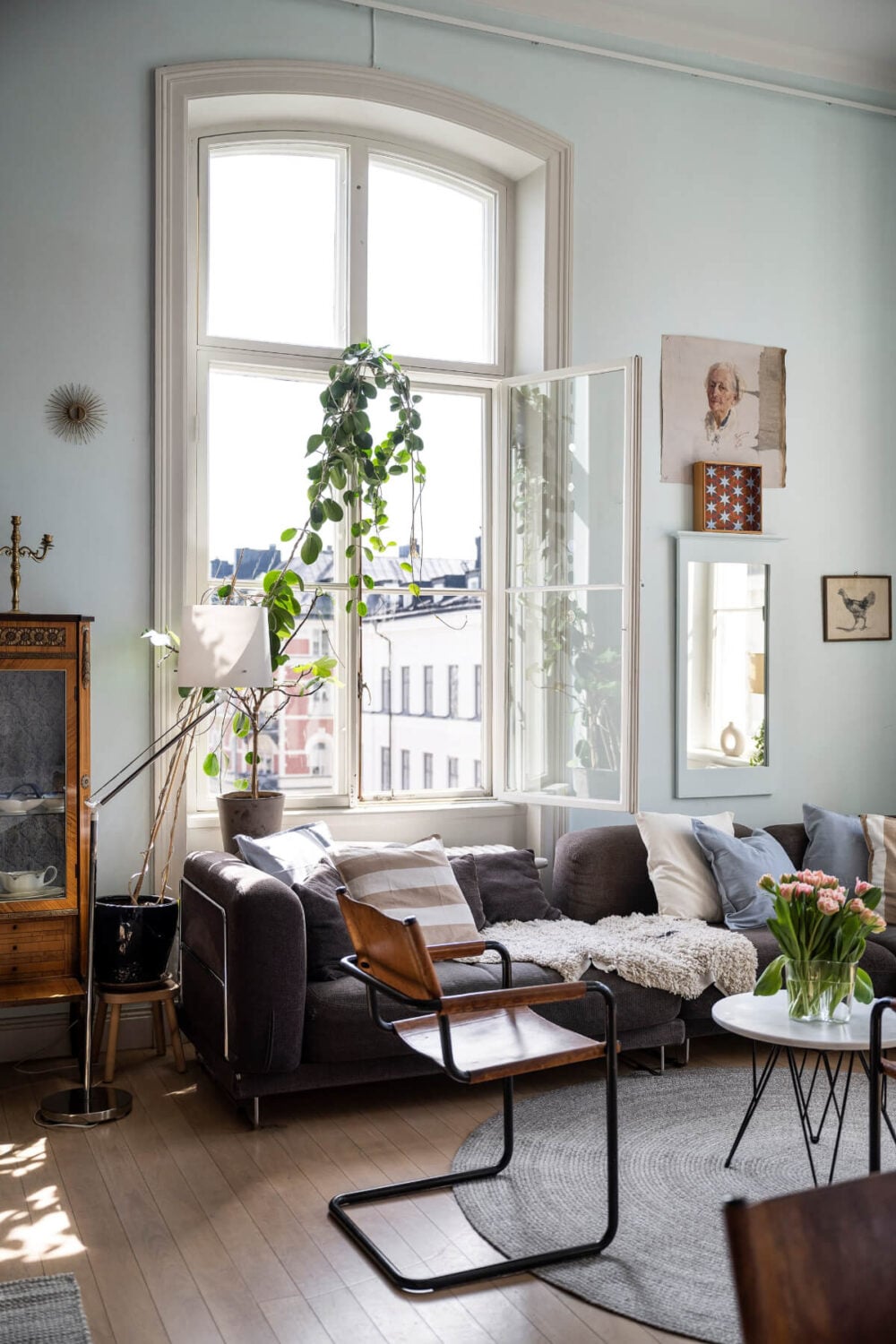 Pale Blue Walls and Huge Windows in a Swedish Loft Apartment 5 large opened window living room light blue walls
