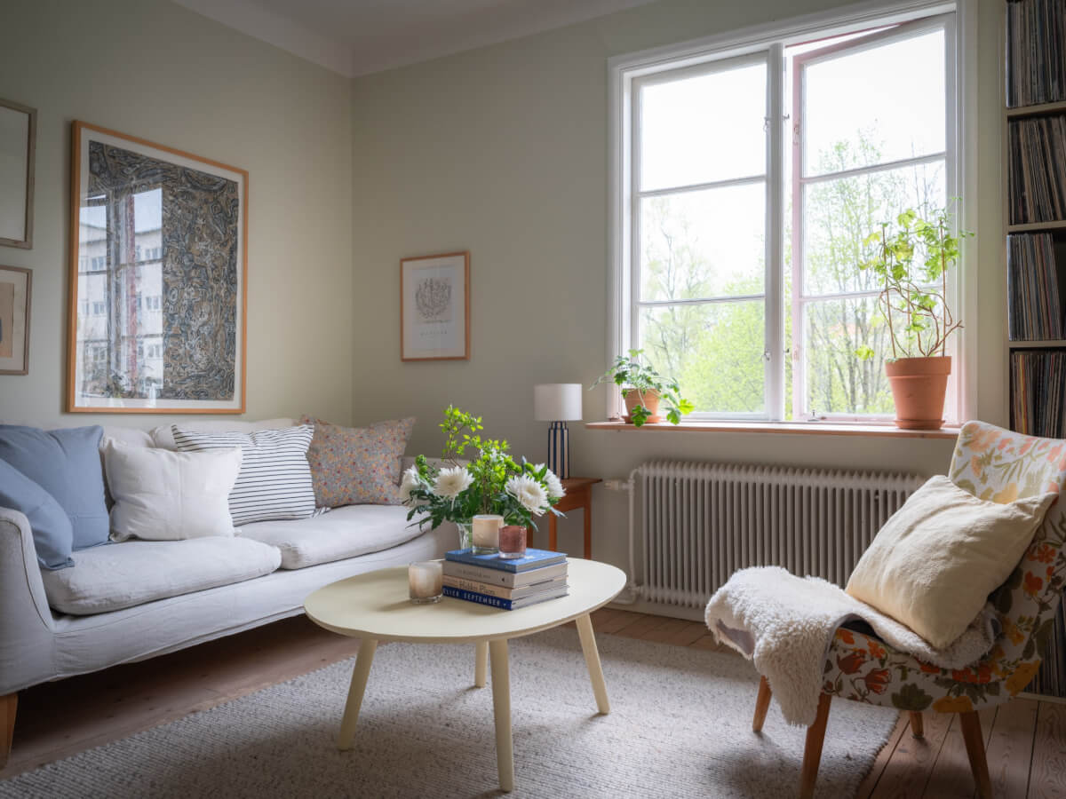 A Soft Color Palette and a Charming Kitchen in a Swedish Apartment 16 large window nordic living room